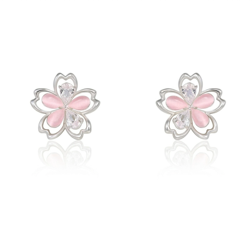 Hollow asymmetrical flower earrings on white background