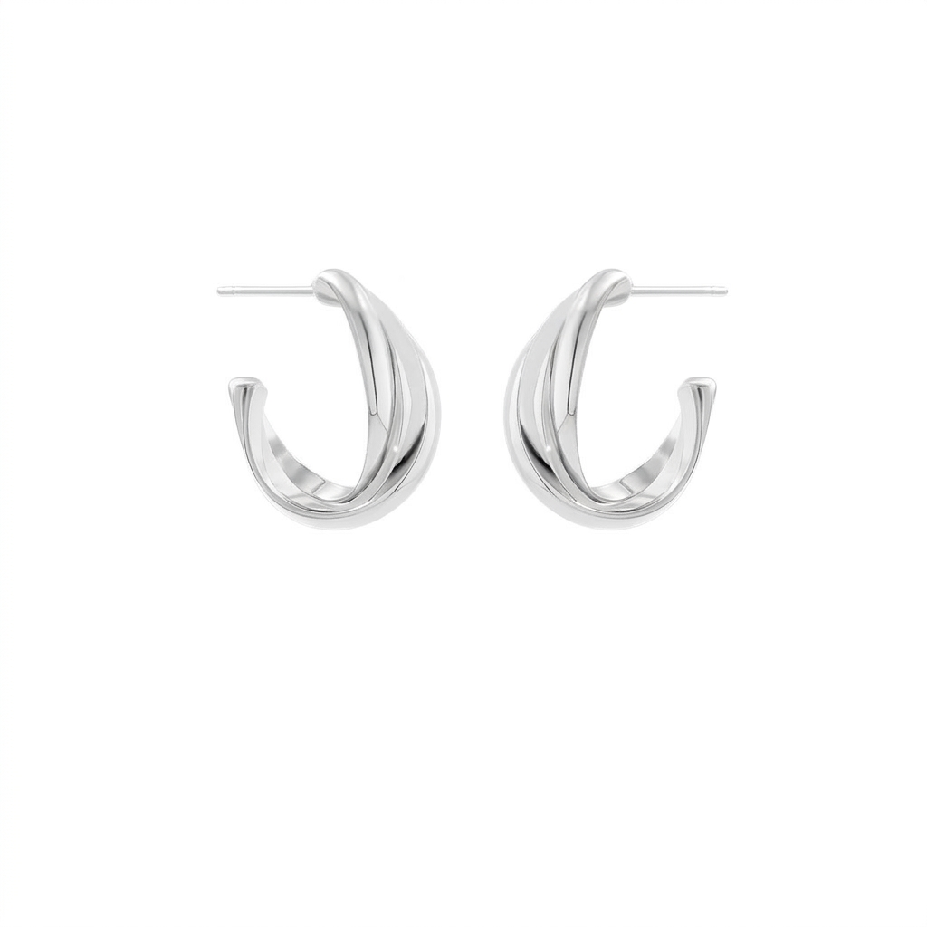 Simple twist metal earrings on white background