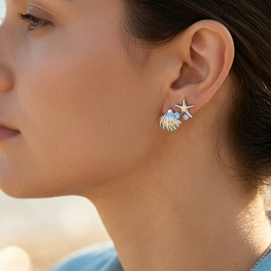 Ocean starfish shell earrings worn on model ear
