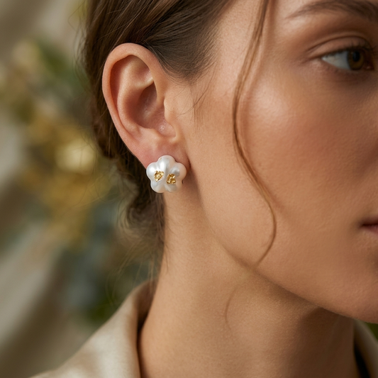 Pearl gold foil earrings worn on model ear