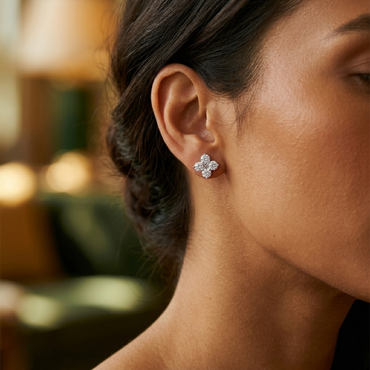 Four-leaf clover star zircon earrings worn on model ear