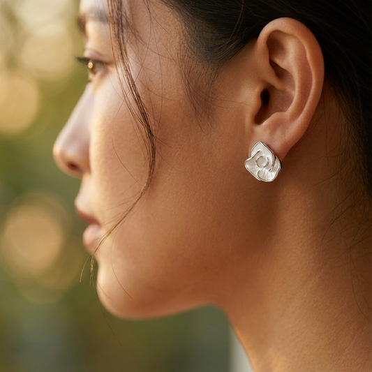 Wine red resin earrings worn on model ear