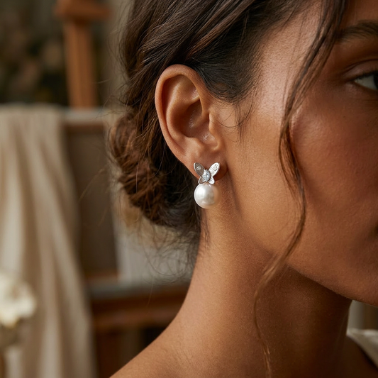Pink white love earrings worn on model ear