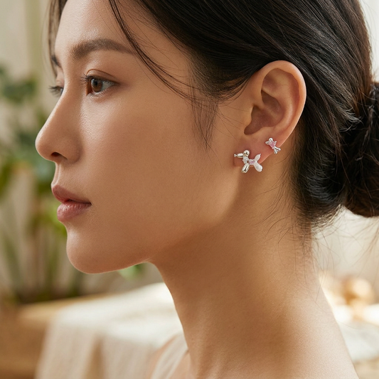 Blue star moon earrings worn on model ear
