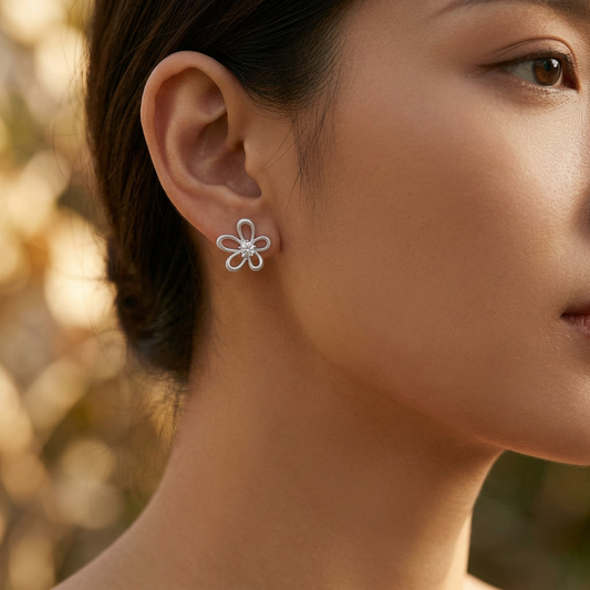 Pink cat eye bow earrings worn on model ear