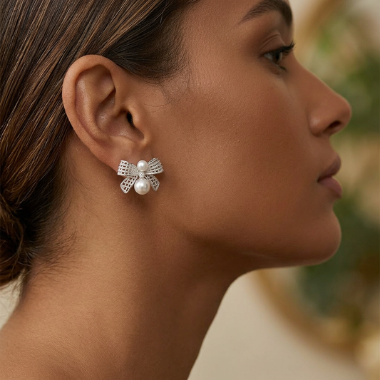 C-ring pearl earrings worn on model ear