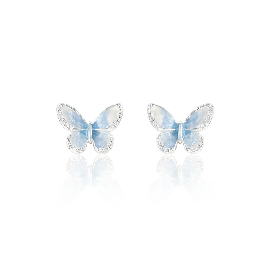 Light blue crystal star earrings on white background
