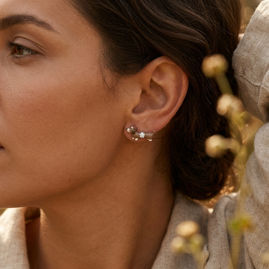 Four-pointed star blue mocha crystal earrings worn on model ear