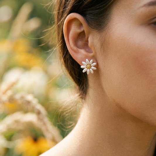 Summer fresh daisy pearl earrings worn on model ear